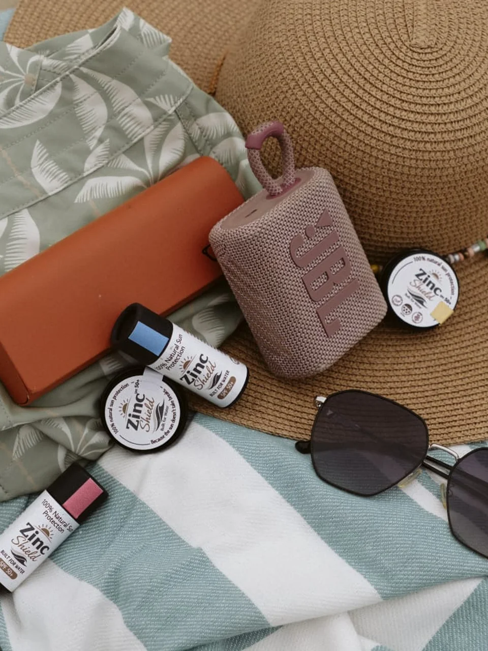 zinc-shield-sunscreen-beach-bag-essentials-flatlay